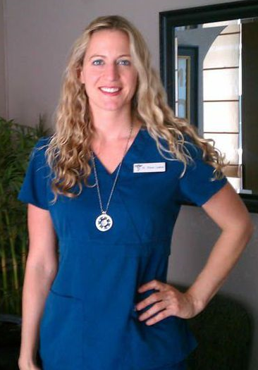 Picture of Diana Lawson, Doctor of Chiropractic in her medical scrubs